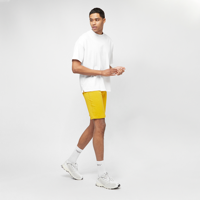 New Balance Unissentials Legging Short varsity gold UndefinedColor 7049 4