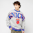 Mitchell & Ness NBA New York Knicks Full Field Satin Fleece Crew grijs